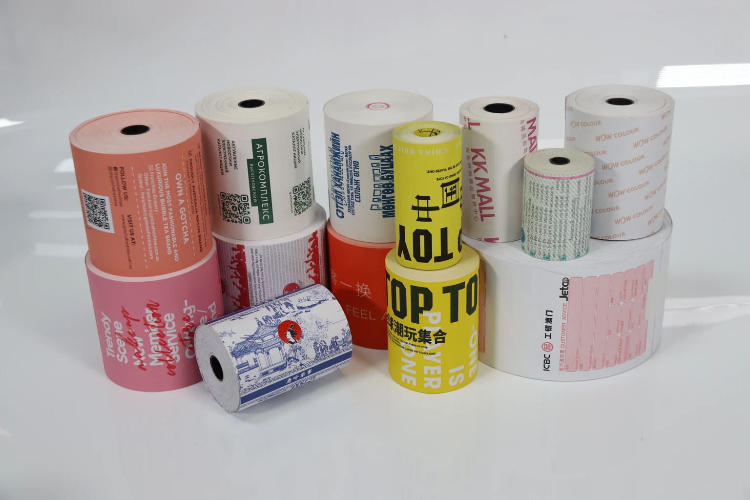 A range of printed paper rolls standing in an arranged group