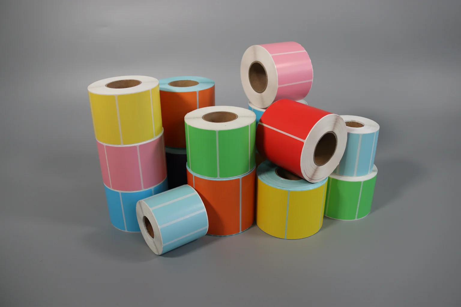 a selection of coloured label-paper rolls