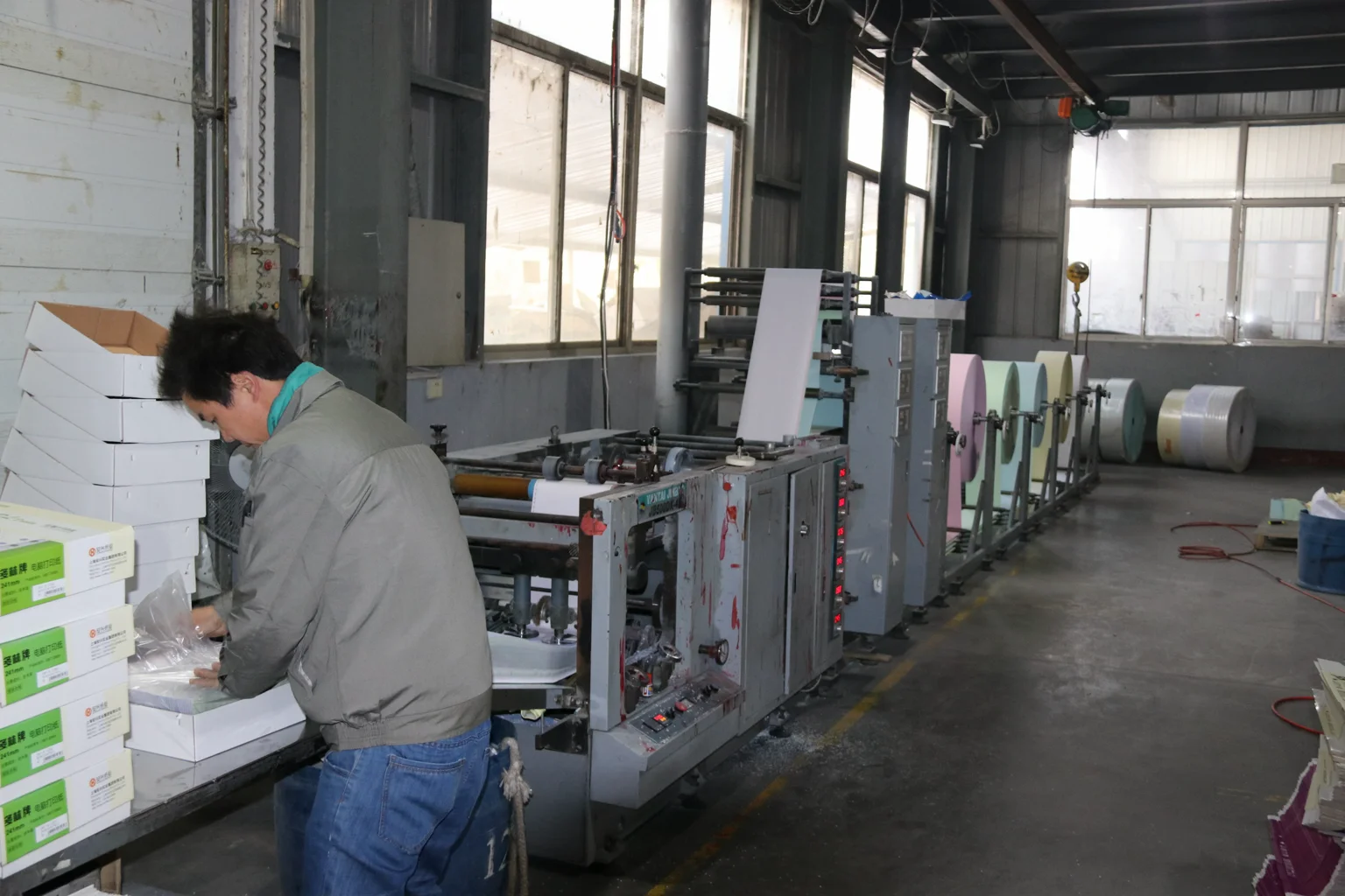 business-paper production equipment and an operator