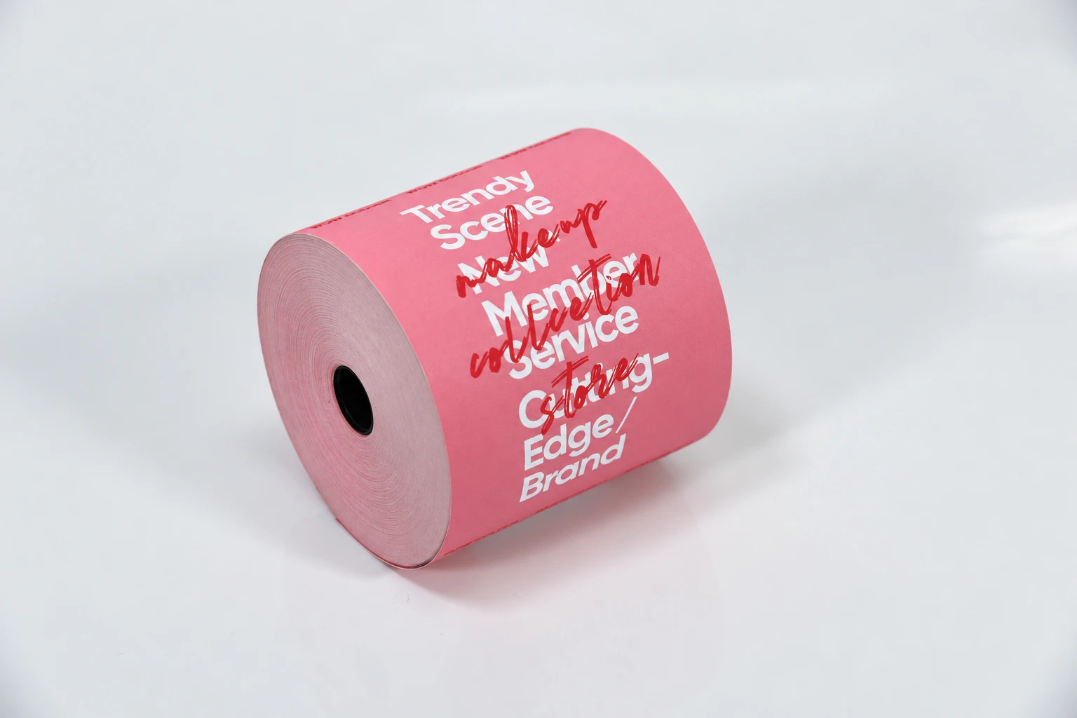 Pink receipt-paper roll carrying preprinted artwork