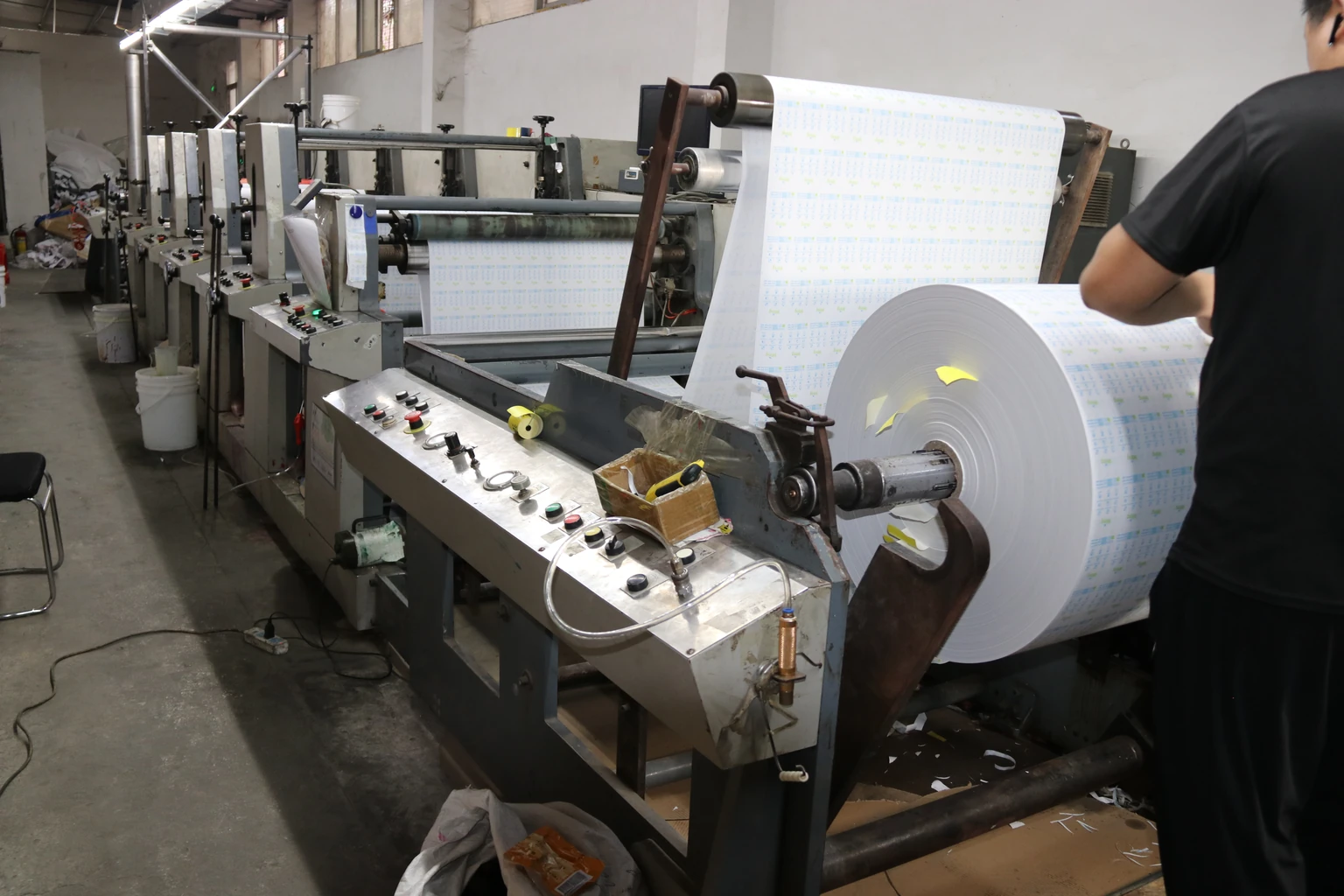 an operator at a receipt-paper printing line